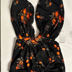 Look fabulous in this fun Black One Piece Swim Suit.